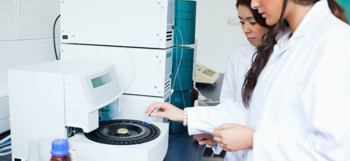 Students using a centrifuge Students using a centrifuge in a laboratory