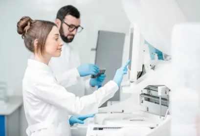 laboratory-assistants-working-with-analizer-2023-11-27-05-23-42-utc-min